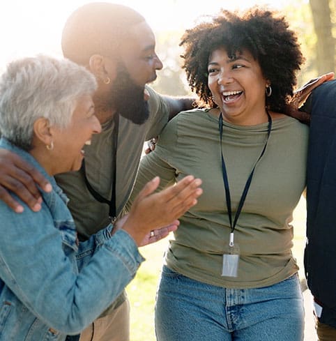 Huddle, happy and volunteer group outdoor with collaboration, teamwork and donation for charity work