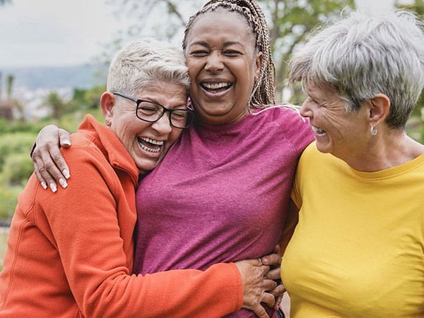 Happy multiracial senior women