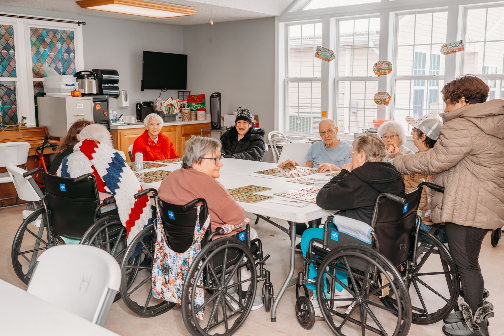 gathering in room with staind glass